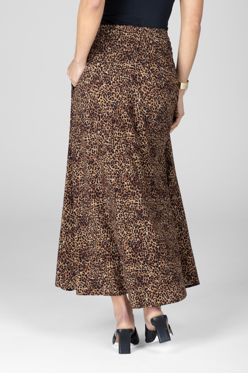 Back view of woman wearing leopard print maxi skirt