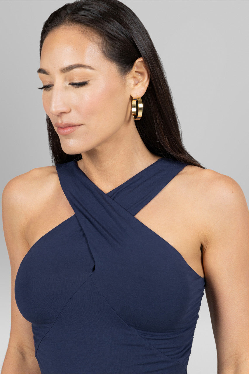 Close-up of the KiraGrace Luxe Halter in marine navy, highlighting the luxurious fabric texture and sophisticated design details that elevate its appeal