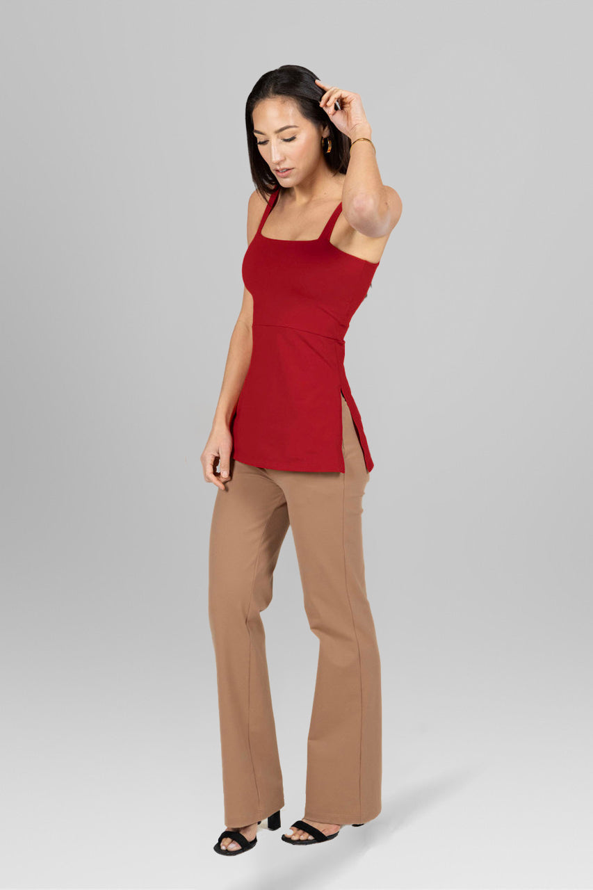 Side view of the Side Slit Cami in Rouge paired with khaki dress pants, highlighting the stylish design and elegant silhouette for a chic look