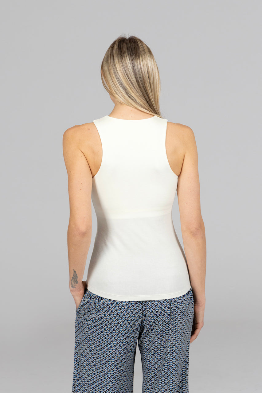 Back view of the Travel Tank in ivory, highlighting its sleek design and comfortable fit that enhances its stylish appeal.