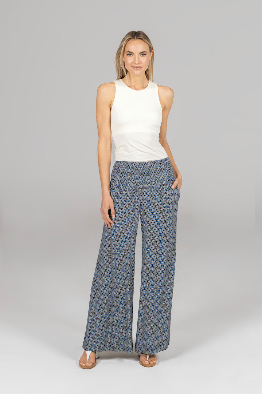 Full outfit featuring the Travel Tank in ivory, paired with complementary bottoms, showcasing a chic and cohesive look perfect for various occasions.