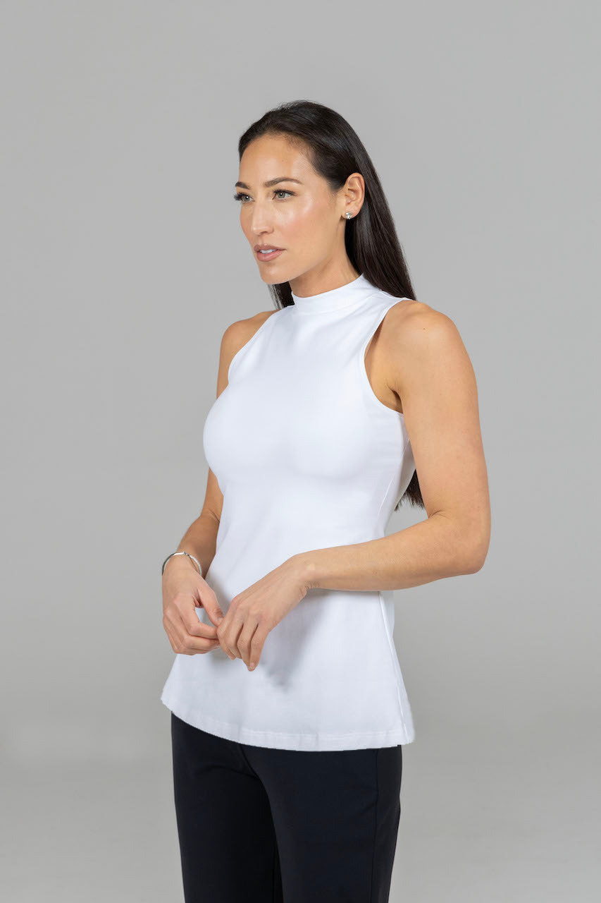 Side view of the Julia Mock Top in white, showing its silhouette and design from the side.