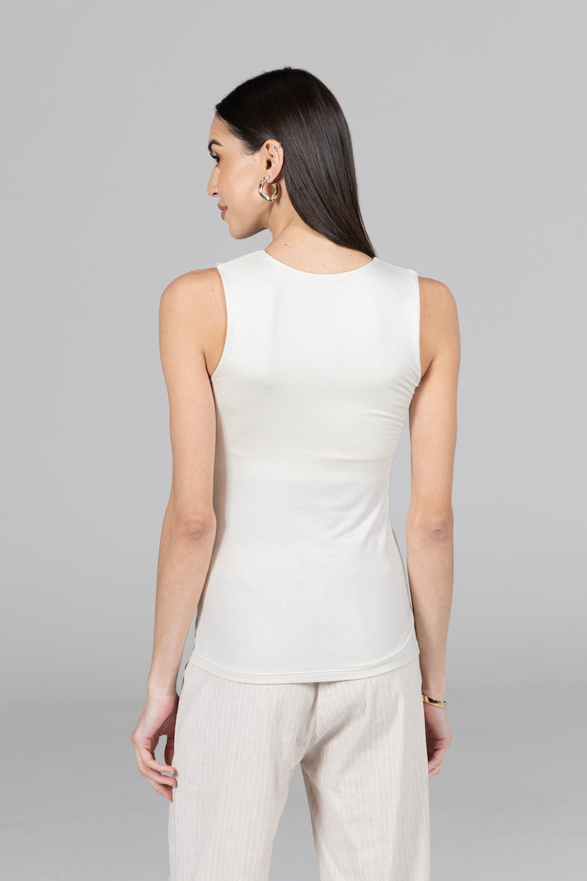 Back view of the Roslyn Tank in ivory, highlighting the elegant design and comfortable fit that enhance its chic appeal.