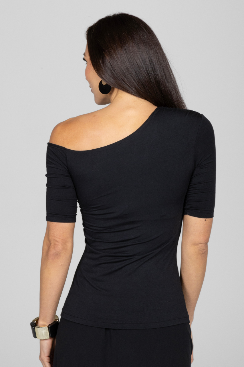 Back view of a woman wearing one shoulder short sleeve top with side ruching