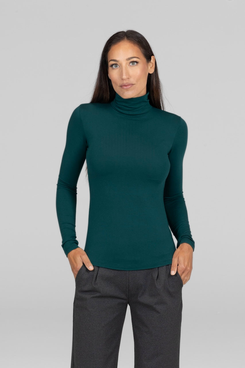 Front view of Grace Turtleneck in emerald, highlighting the vibrant green color and classic turtleneck design.