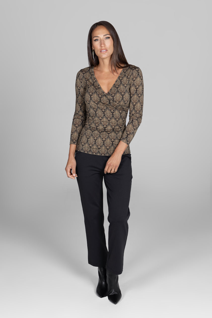 Front view of the Nina Straight Leg Ankle Pant in black, paired with a printed top, showcasing a chic and sophisticated outfit perfect for any occasion