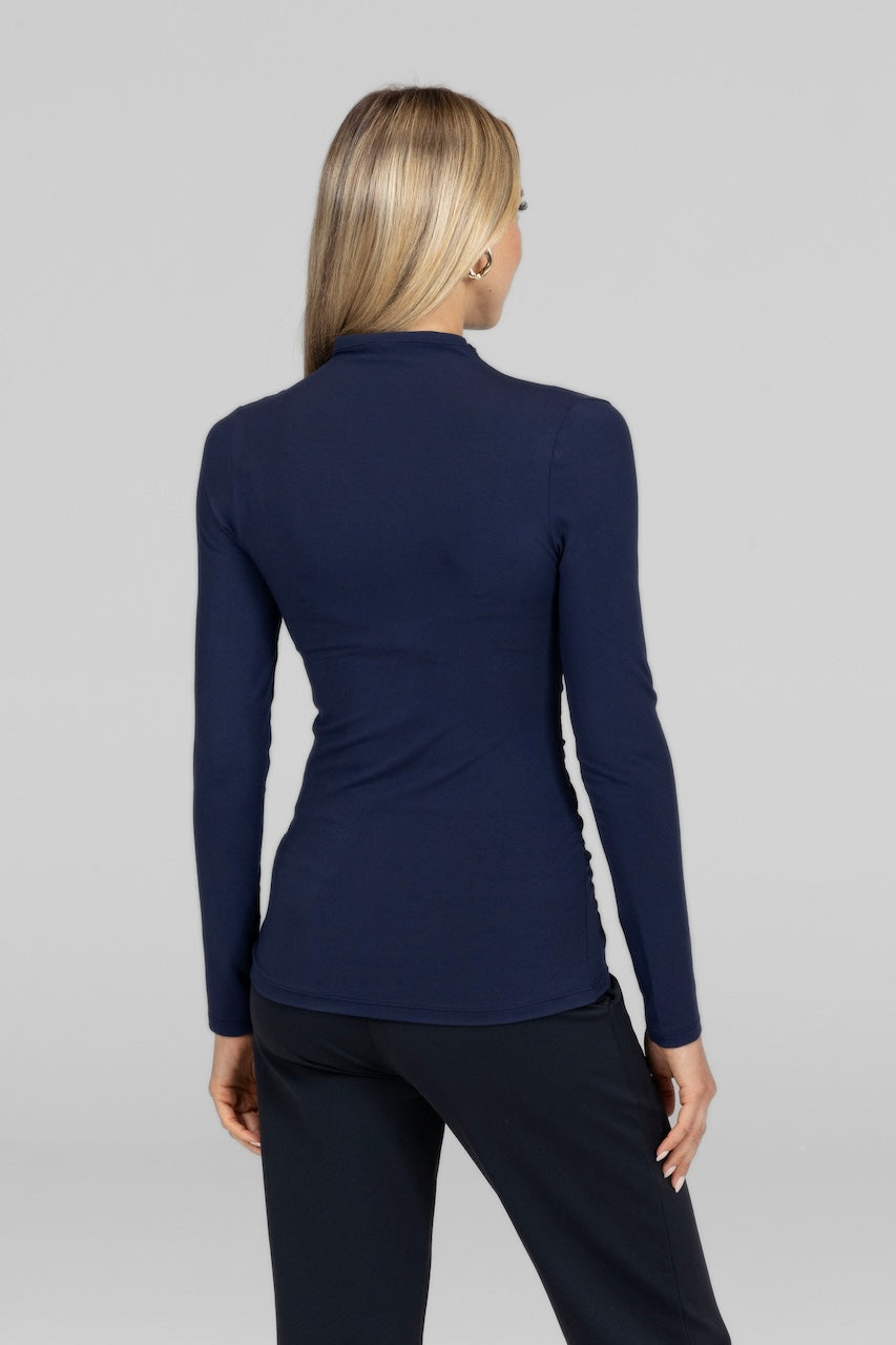 Back view of Luxe Draped Long Sleeve in marine navy, showcasing the smooth, flowing design.