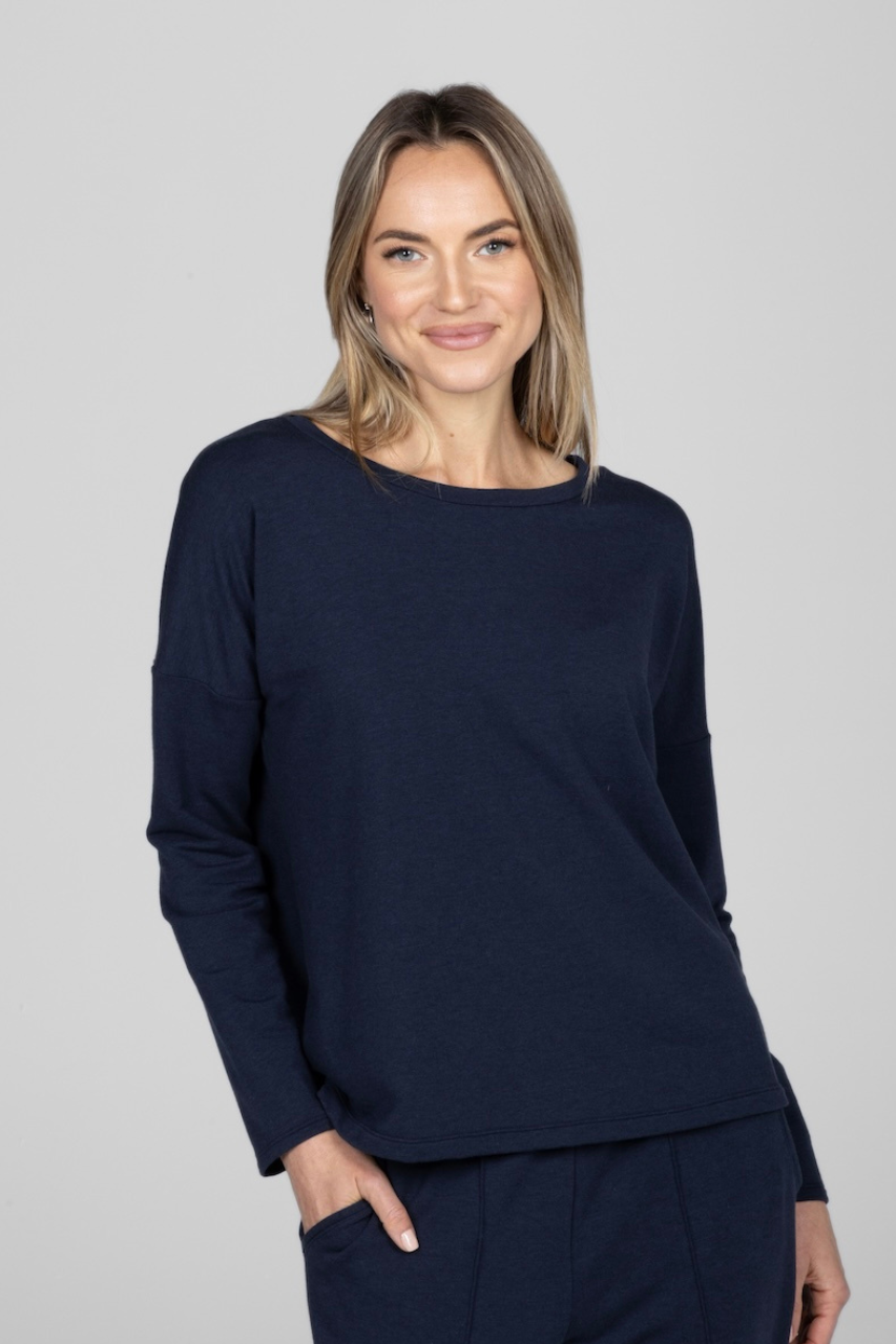 Woman wearing navy long sleeve top