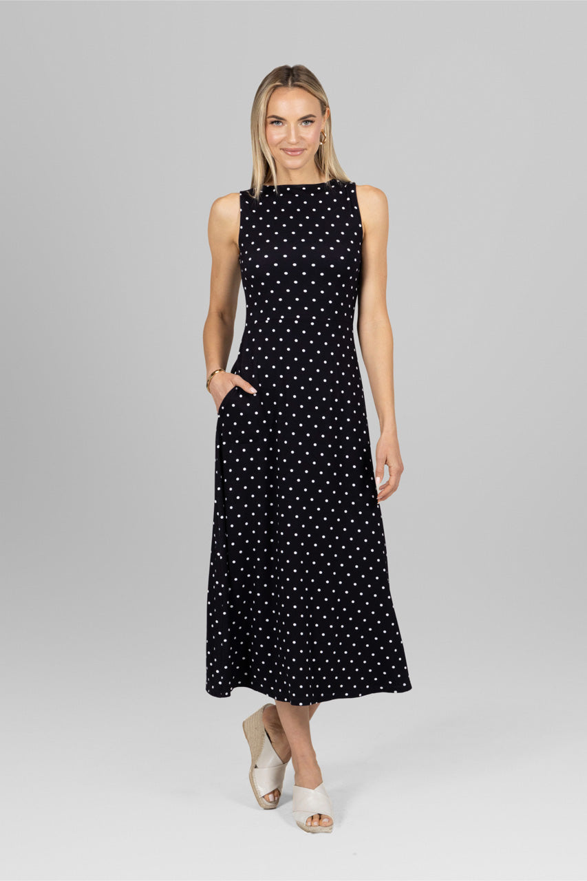 Woman wearing long maxi black dot dress