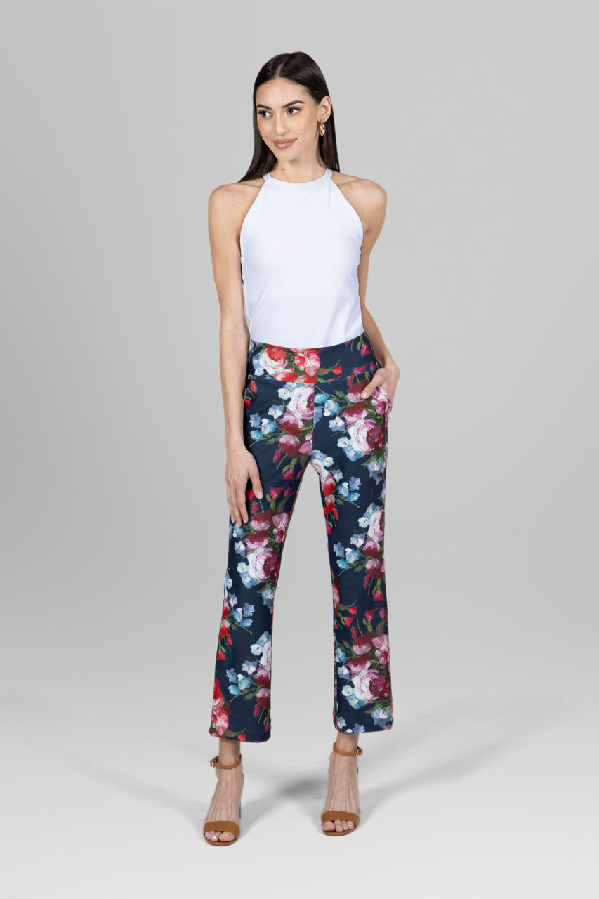 Model wearing a white top paired with the High Waist Ankle Kick Pant in spring floral, showcasing a fresh and stylish look perfect for the season