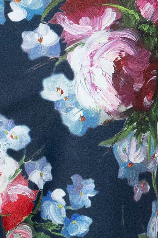 Close-up of the floral print featuring delicate pink and blue flowers, showcasing the intricate details and vibrant colors that bring the design to life