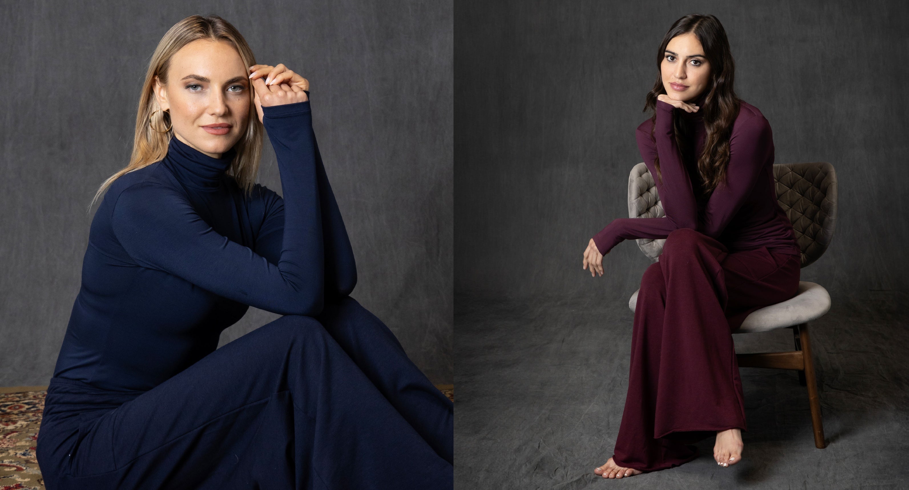 Two women in navy and burgundy lounge sets sitting against a dark gray background