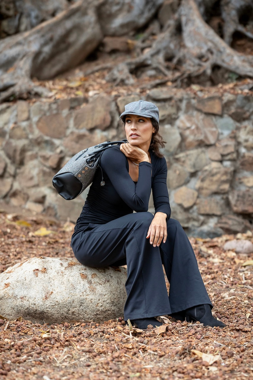 Model wearing black Square Neck Long Sleeve Top paired with high-waisted trousers for a sleek, contemporary look.