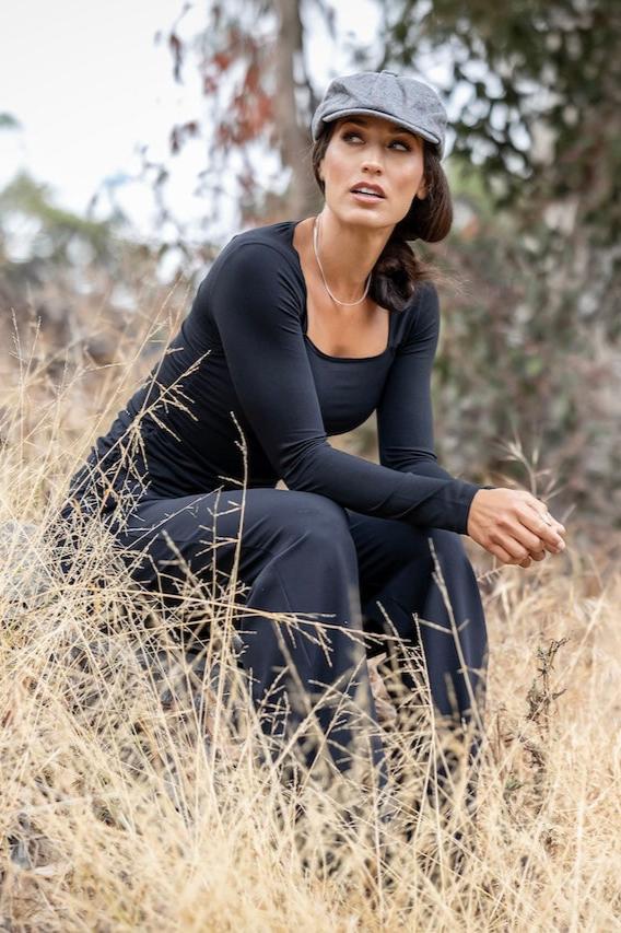 Model wearing black Square Neck Long Sleeve Top during a casual outing, demonstrating its versatile styling options.