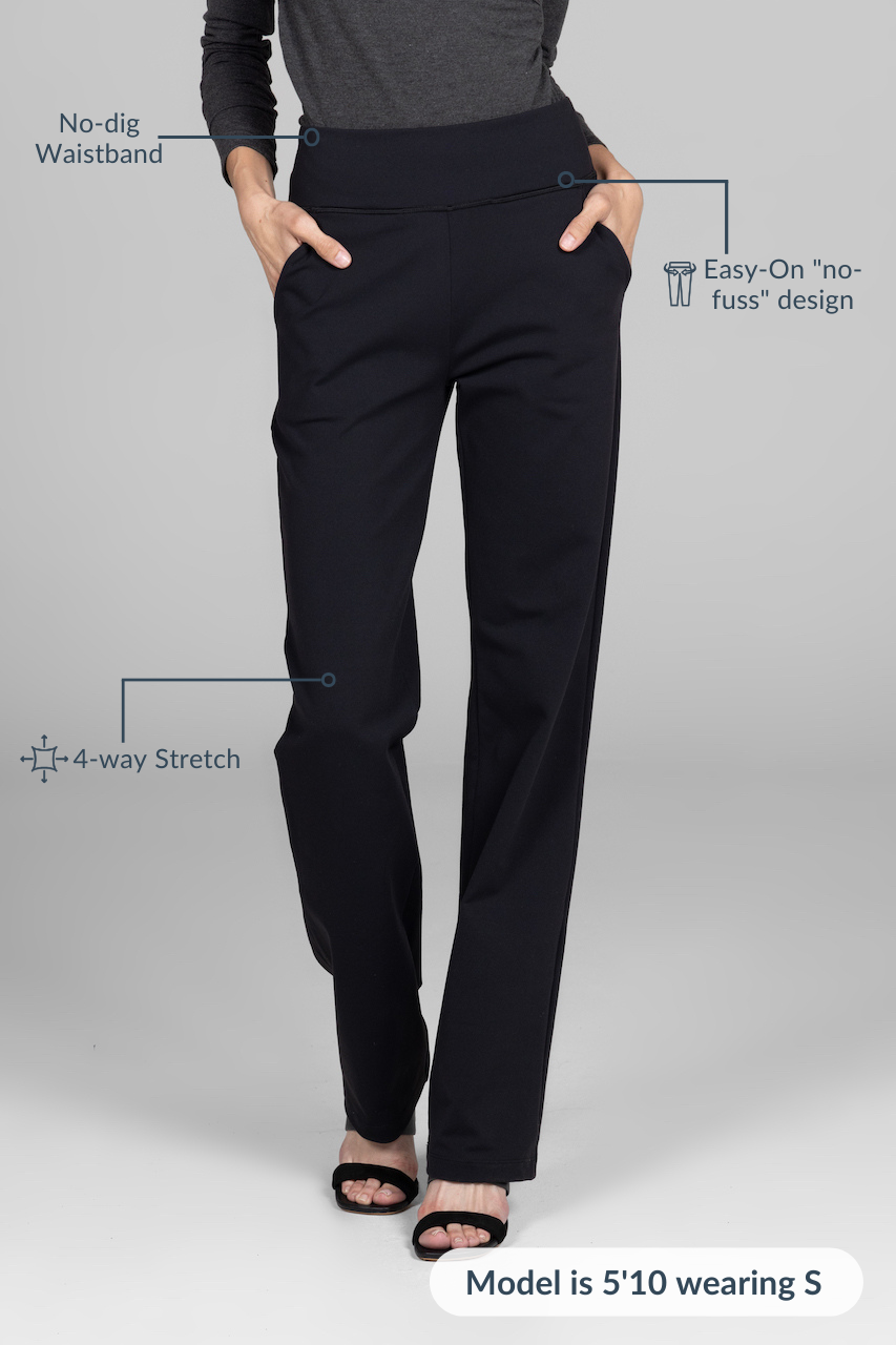 Woman wearing black straight leg pants showing attributes: No-dig waistband, Easy-on "no fuss" design, 4-way stretch