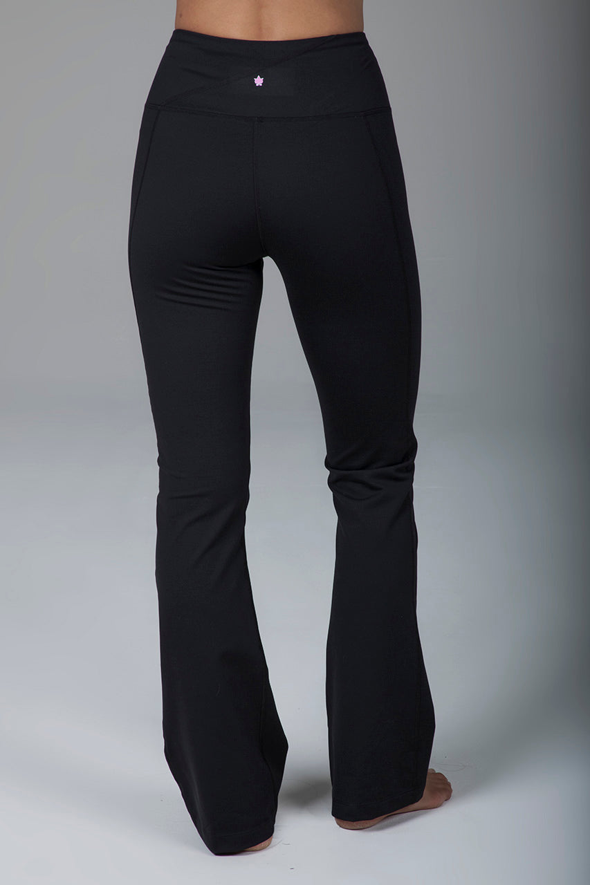 Back view of high-waisted black bootcut yoga pants, highlighting the fit and design of the waistband and leg openings