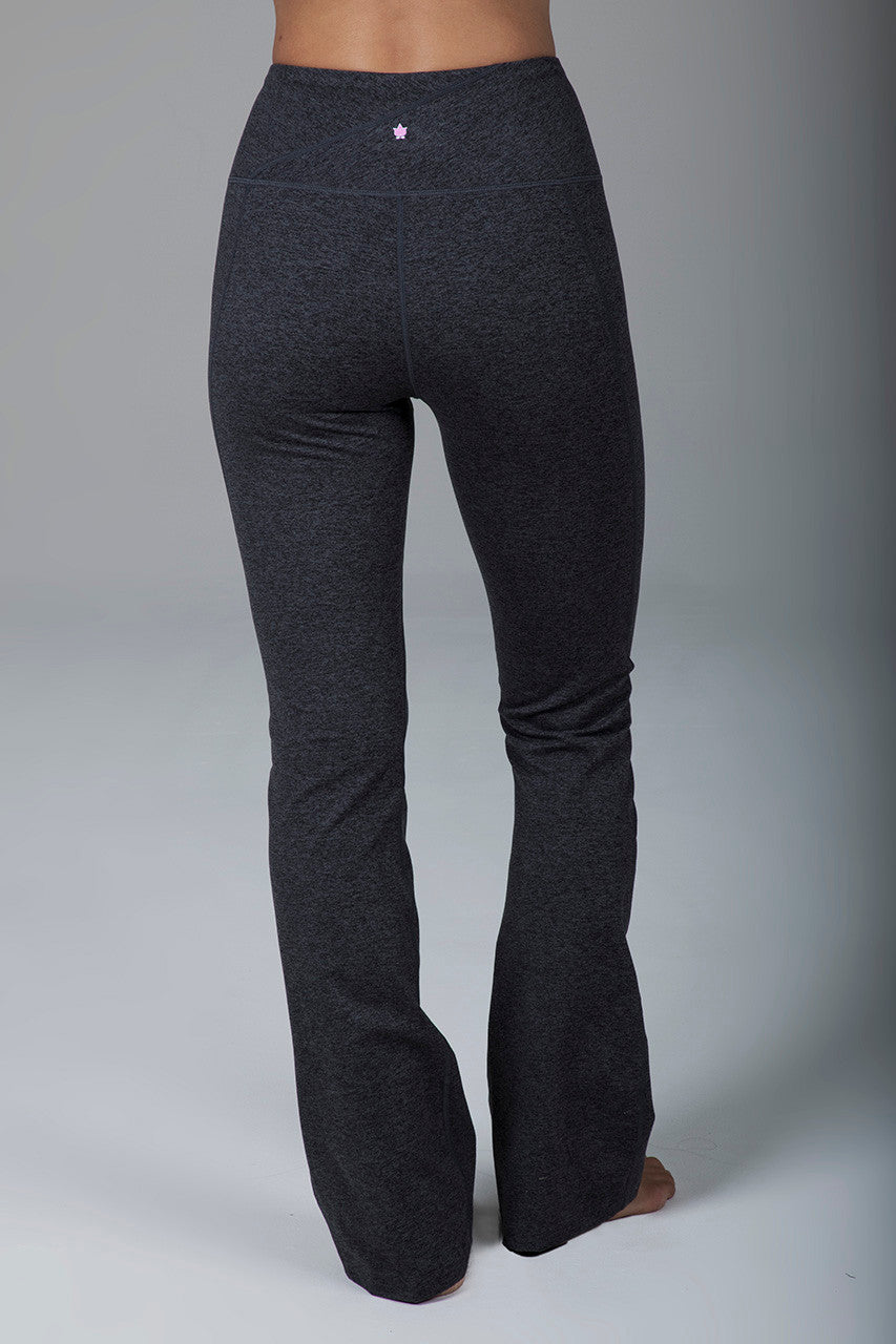 Back view of the High Rise Flare Yoga Leggings in charcoal grey, showcasing the high-rise waistband and smooth, flared leg design