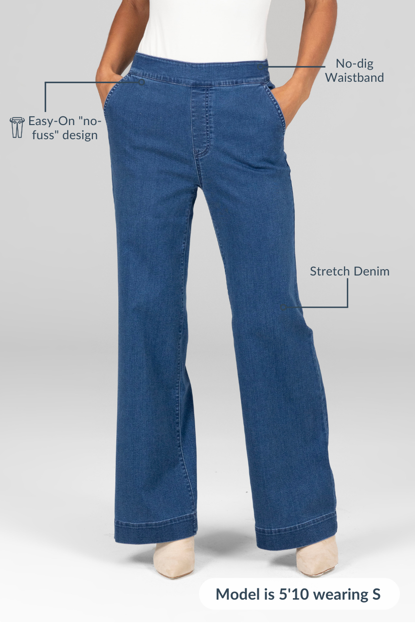 A pair of blue stretch denim trousers with a no-dig waistband, model is 5'10" wearing size S.