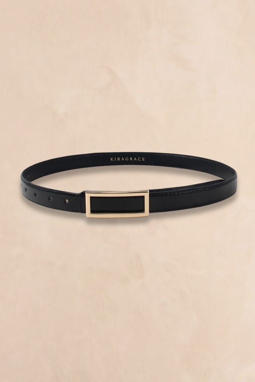 Black KiraGrace belt on a beige background