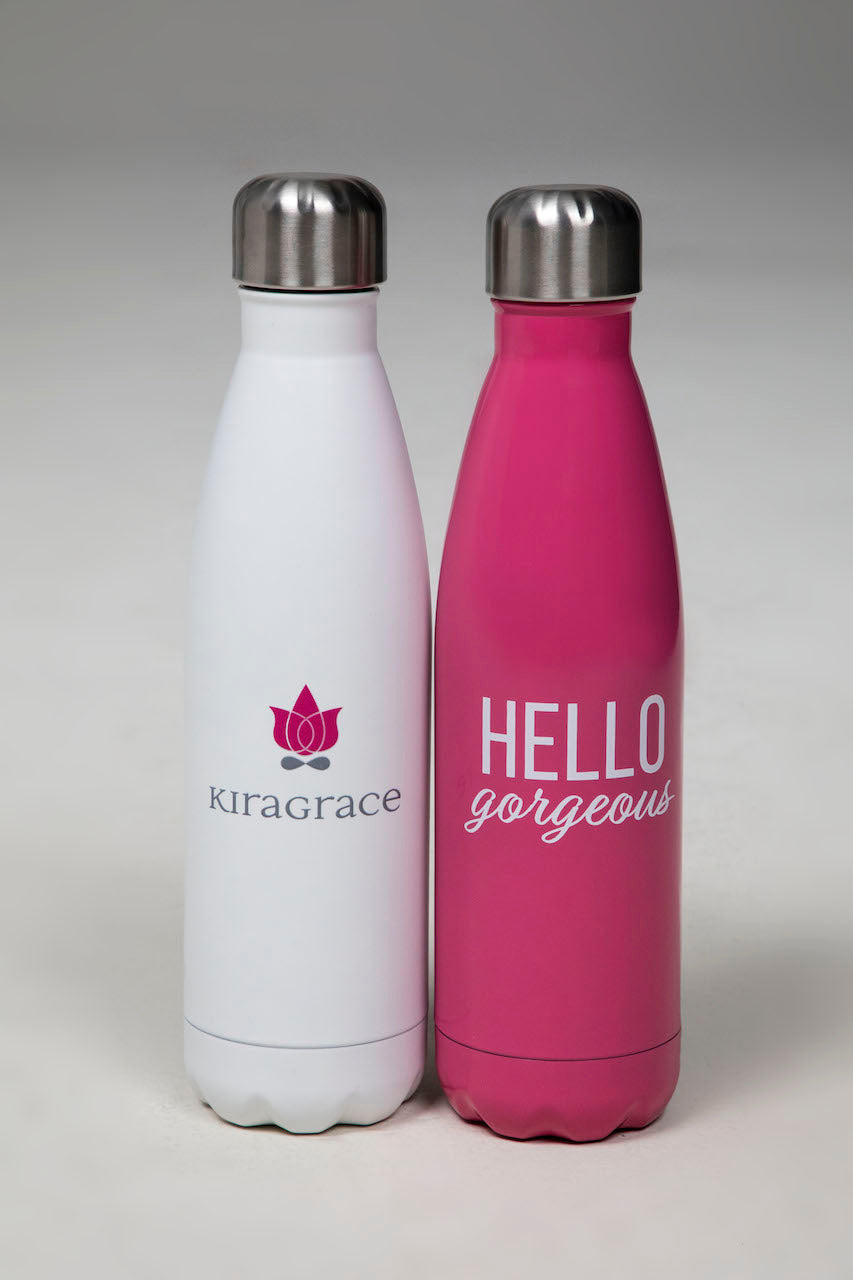 Two insulated water bottles next to each other, one white and white pink