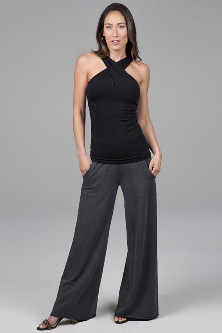 Front view of a full outfit featuring the KiraGrace Cozy Boho Yoga Pant in charcoal heather paired with a halter top, showcasing a stylish and comfortable look