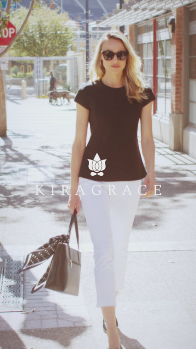 Women walking around downtown showing fast paced life and black and white collection