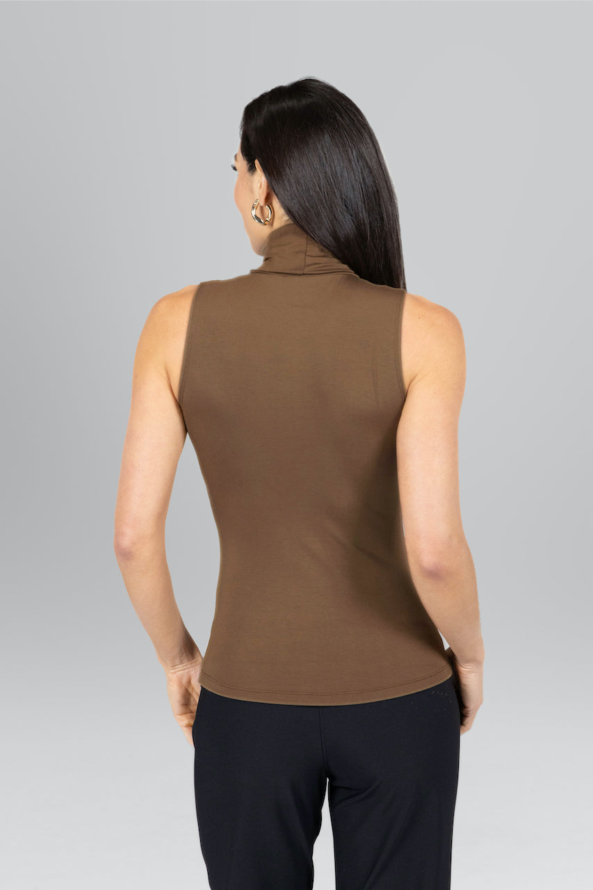Back view of woman wearing brown sleeveless turtleneck