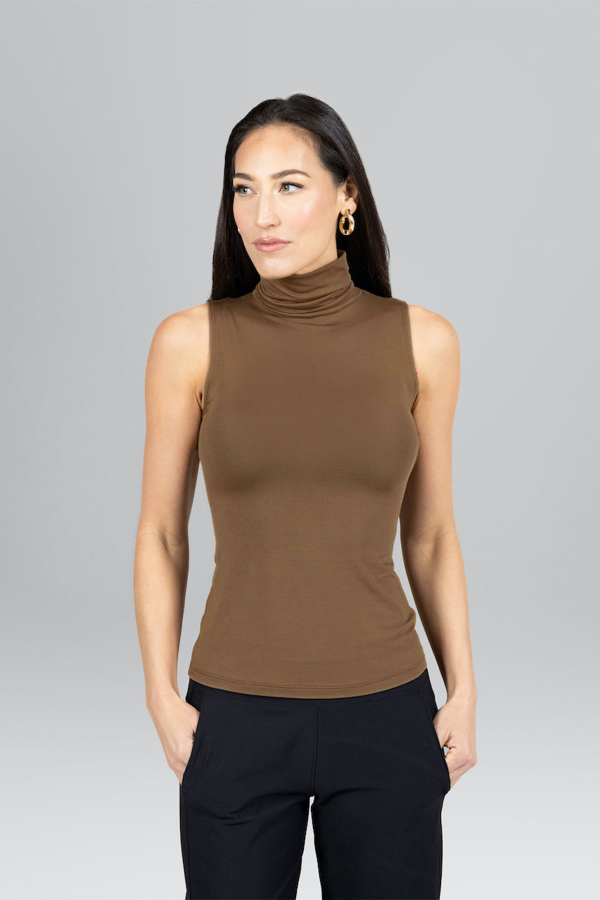 Woman wearing brown sleeveless turtleneck